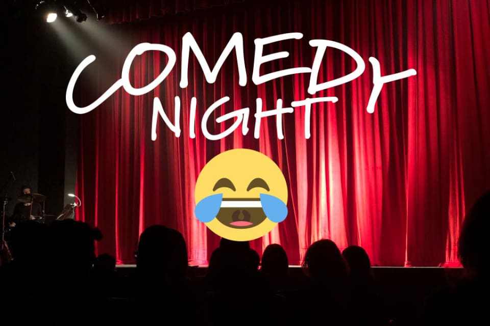 Comedy night with emojis in front of a red curtain.